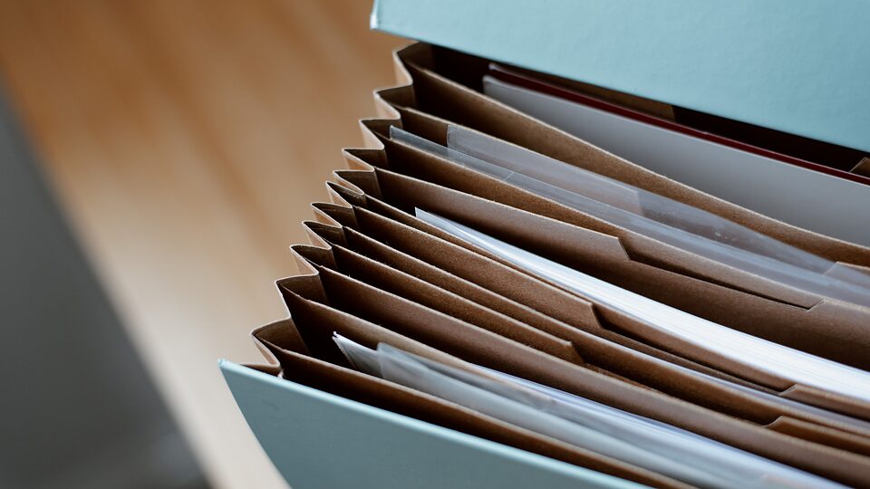Document folders arranged in a filing box